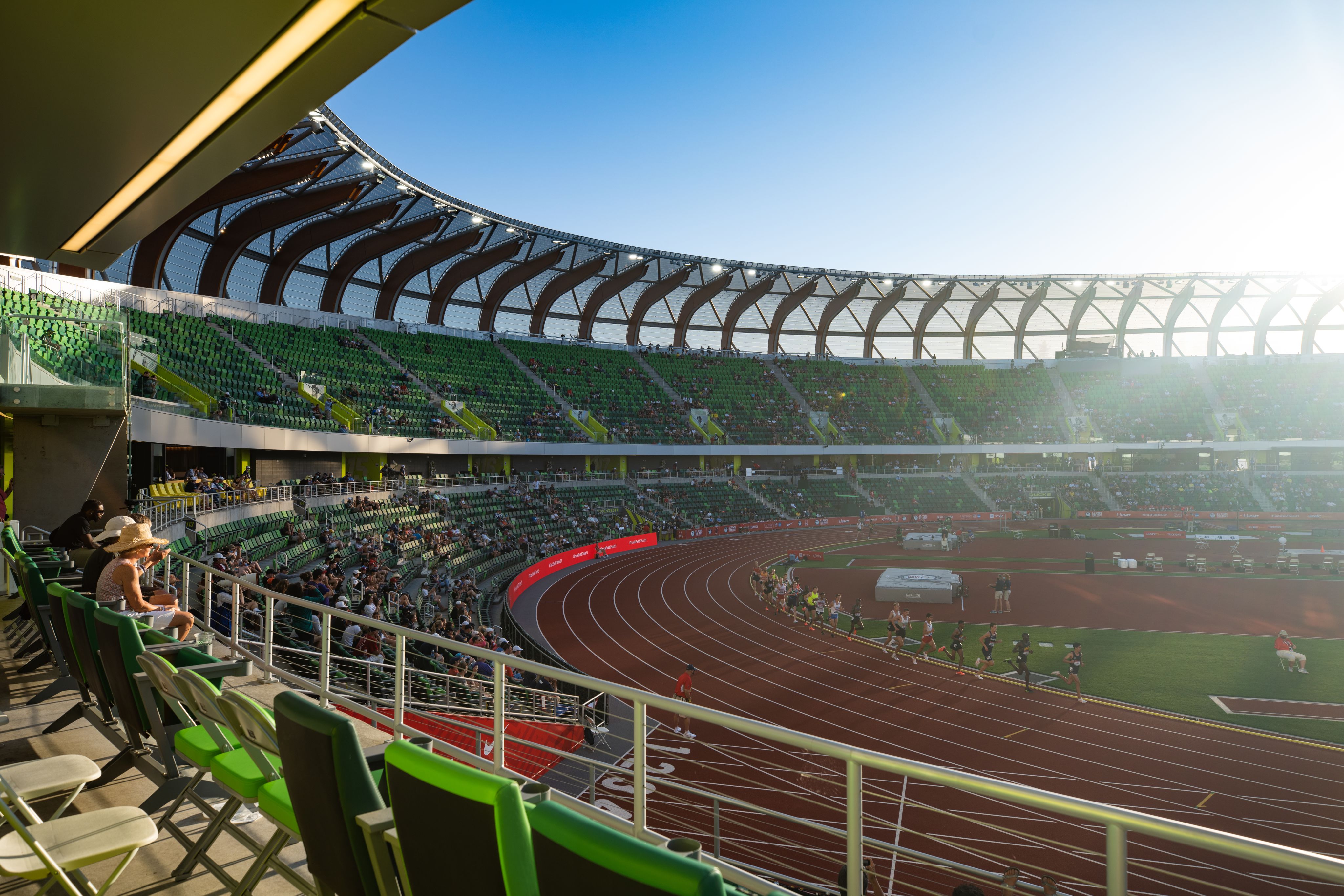 A photo of people running on the track inside Hayward Field