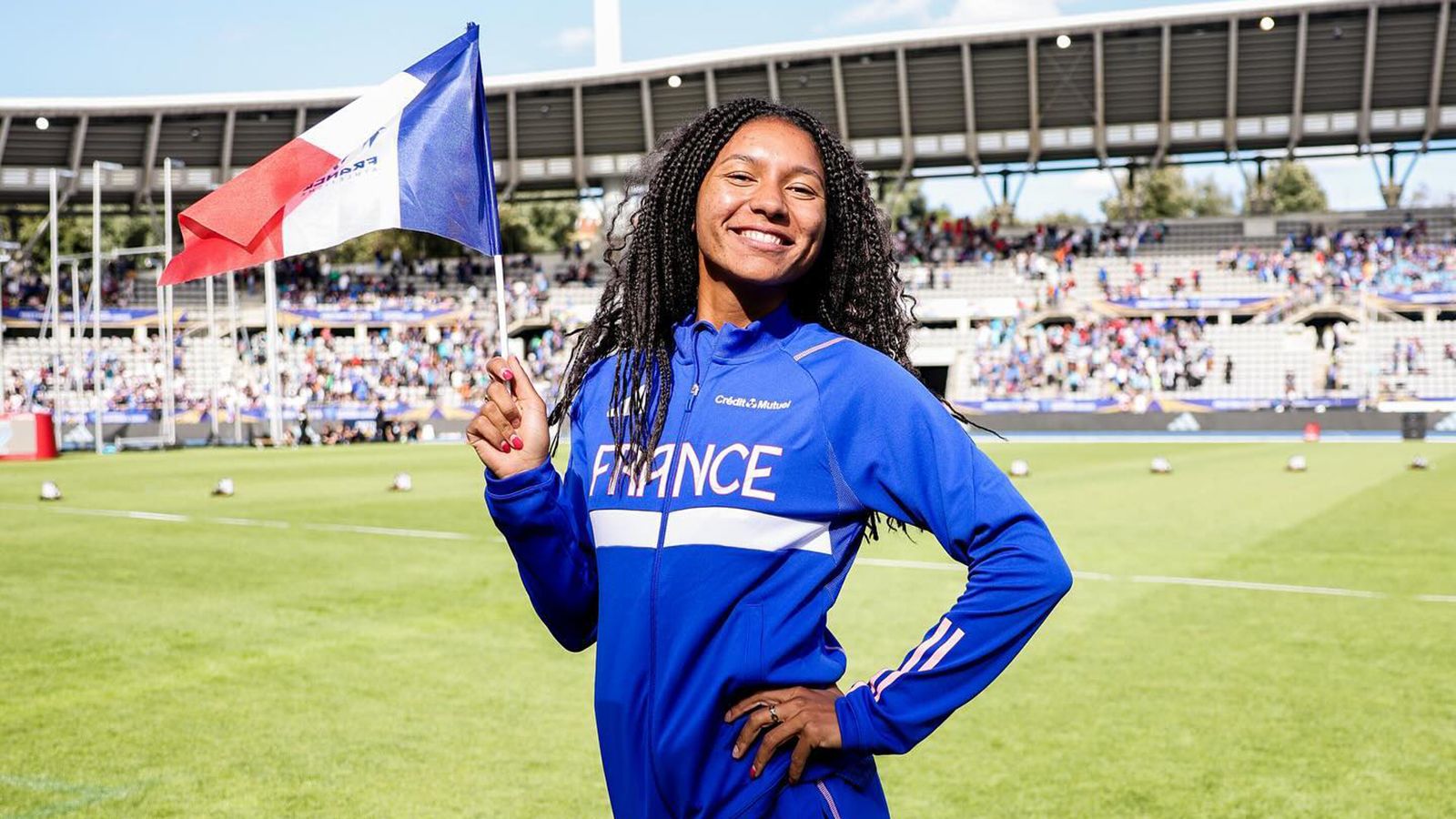 Shana Grebo holding France's flag