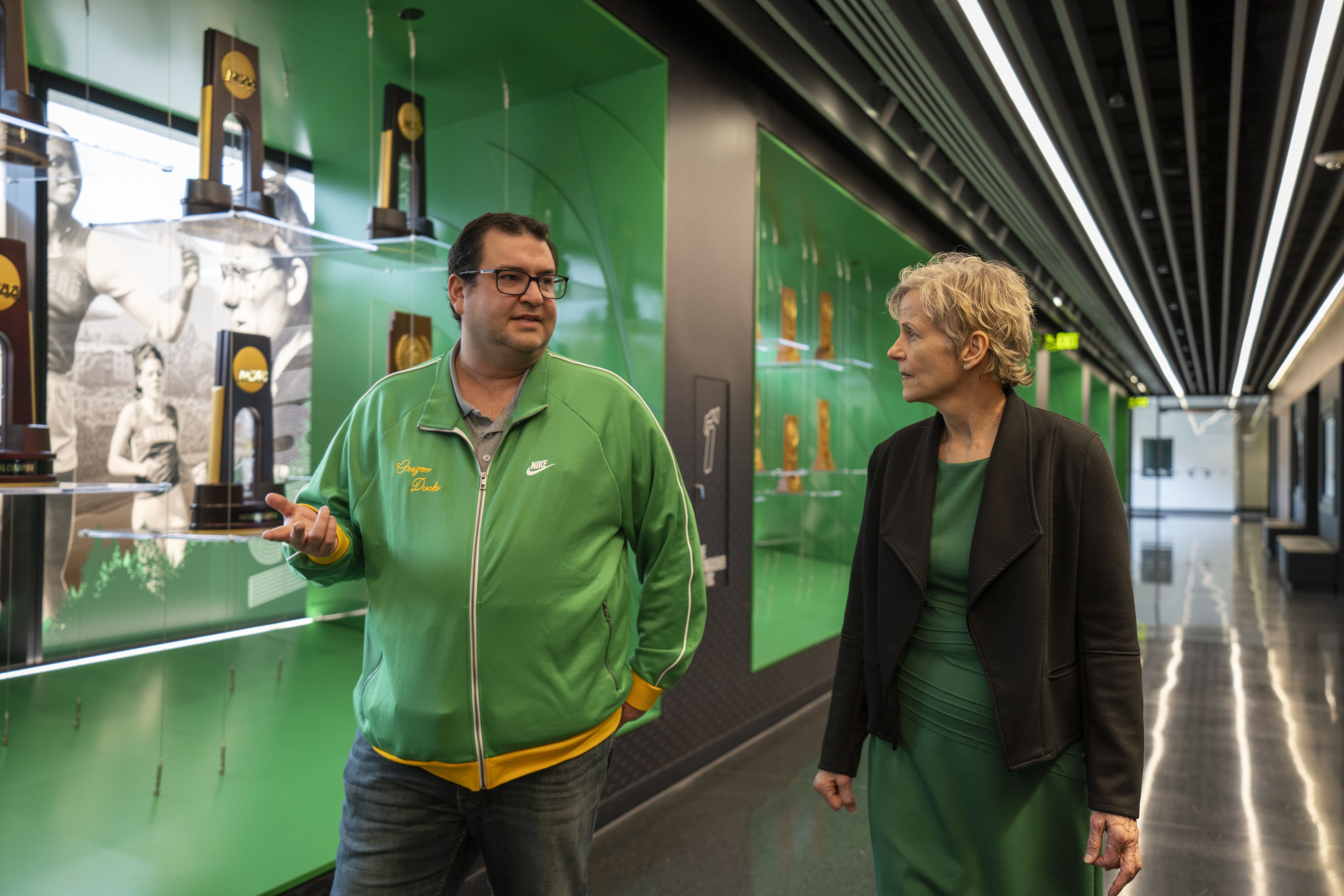 A photo of Yoav Dubinsky and T. Bettina Cornwell walking and talking