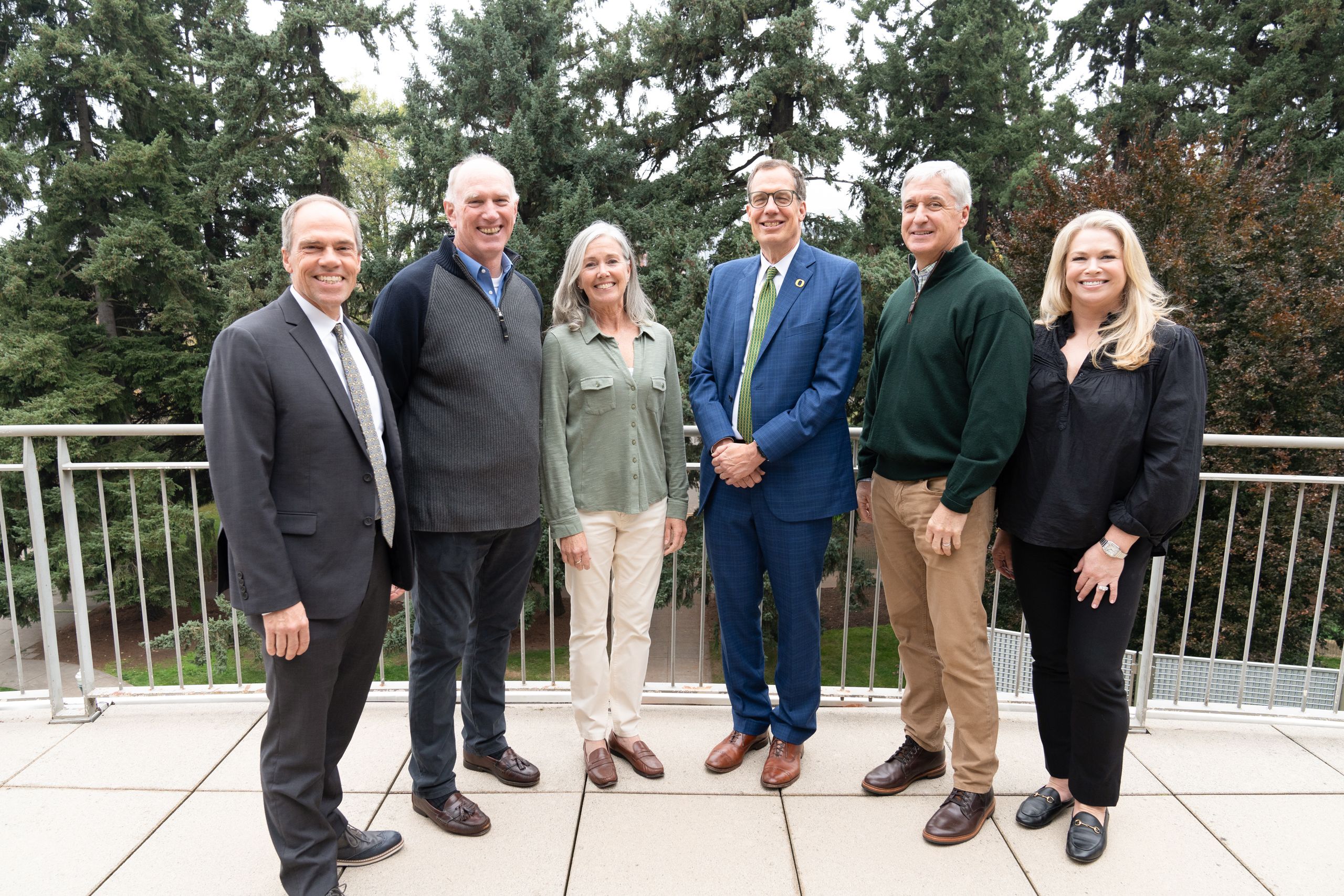 A group photo of UO President Sholtz, Lundquist Dean Bruce Blonigen, Sue and Dave McDonald, and Paul and Megan Cameron.